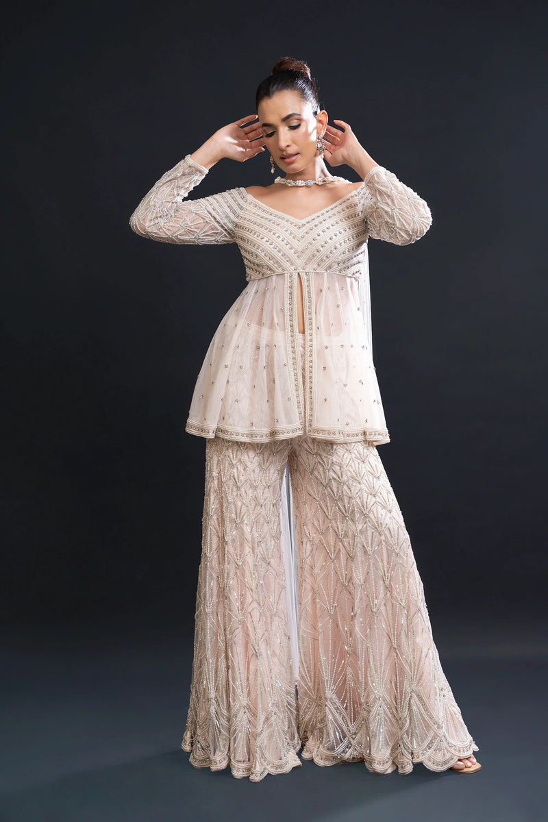 Designer Sharara Sets for Women | Blush Pink Bridal Sharara Set with Pearl Work and Sequin Embroidery for Sangeet and Reception Wear by Aahana's by Nidhi Mehra — Nidhi Mehra designer collection