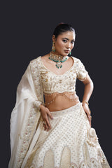 Ivory Bridal Lehenga with Dabka, Pearl Work and Sequin Embroidery for Reception Wear by Aahana's by Nidhi Mehra