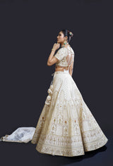 Ivory Bridal Lehenga with Dabka, Pearl Work and Sequin Embroidery for Reception Wear by Aahana's by Nidhi Mehra