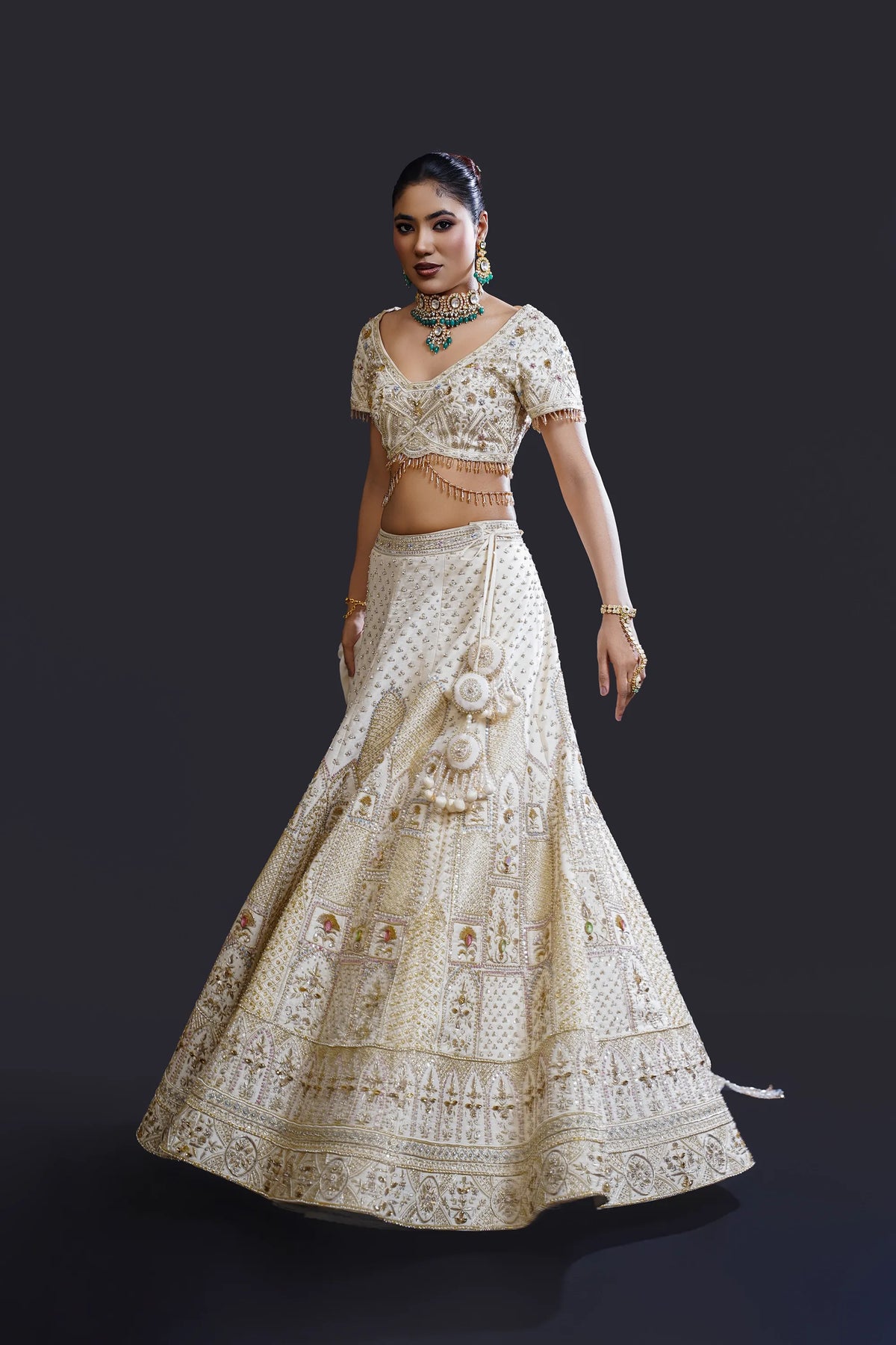 Ivory Bridal Lehenga with Dabka, Pearl Work and Sequin Embroidery for Reception Wear by Aahana's by Nidhi Mehra