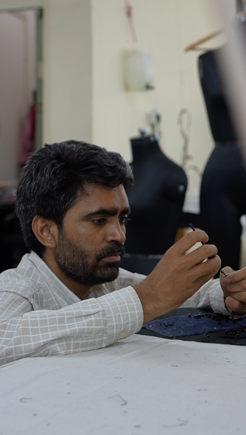 Man sitting at a table in a workshop setting