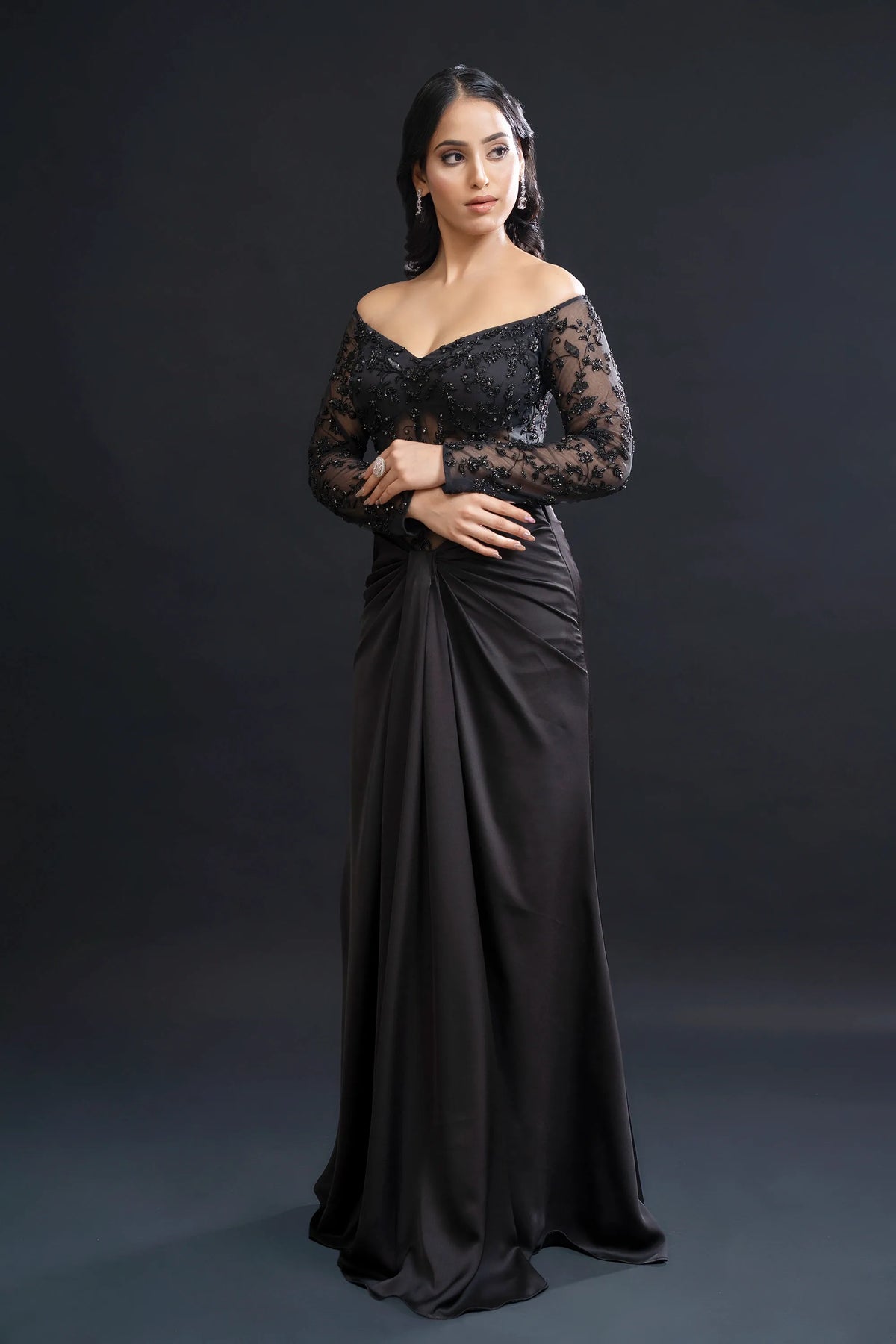 Black Drape Gown with Sequin Embellishment for Reception Wear by Nidhi Mehra Couture