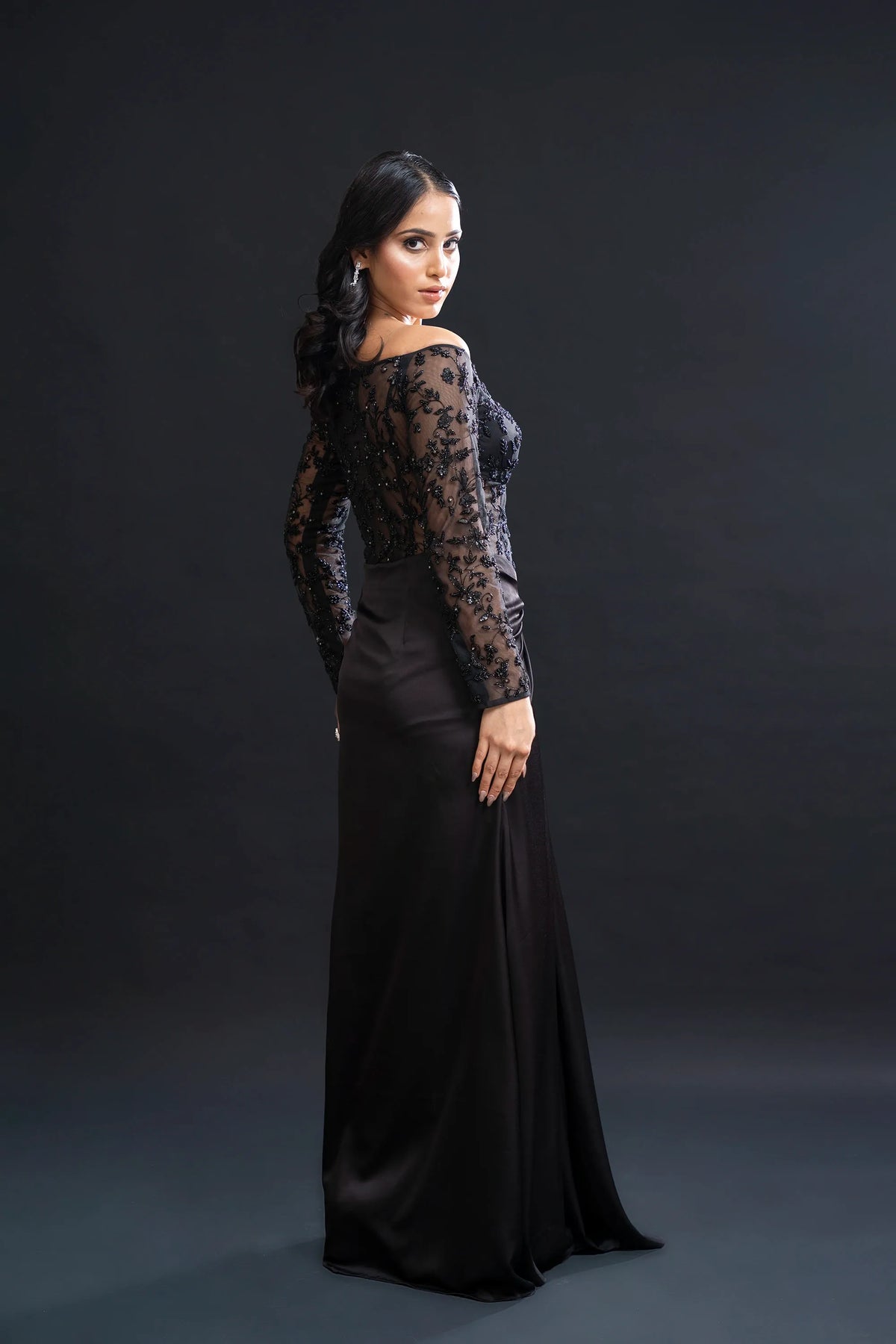 Black Drape Gown with Sequin Embellishment for Reception Wear by Nidhi Mehra Couture