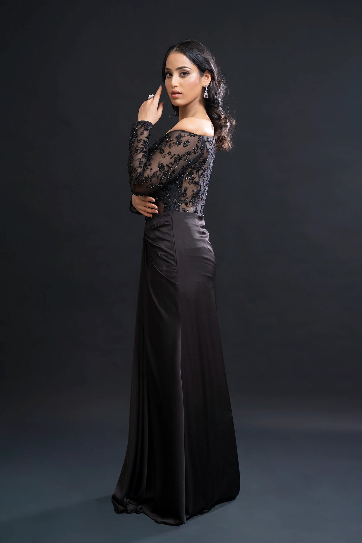 Black Drape Gown with Sequin Embellishment for Reception Wear by Nidhi Mehra Couture