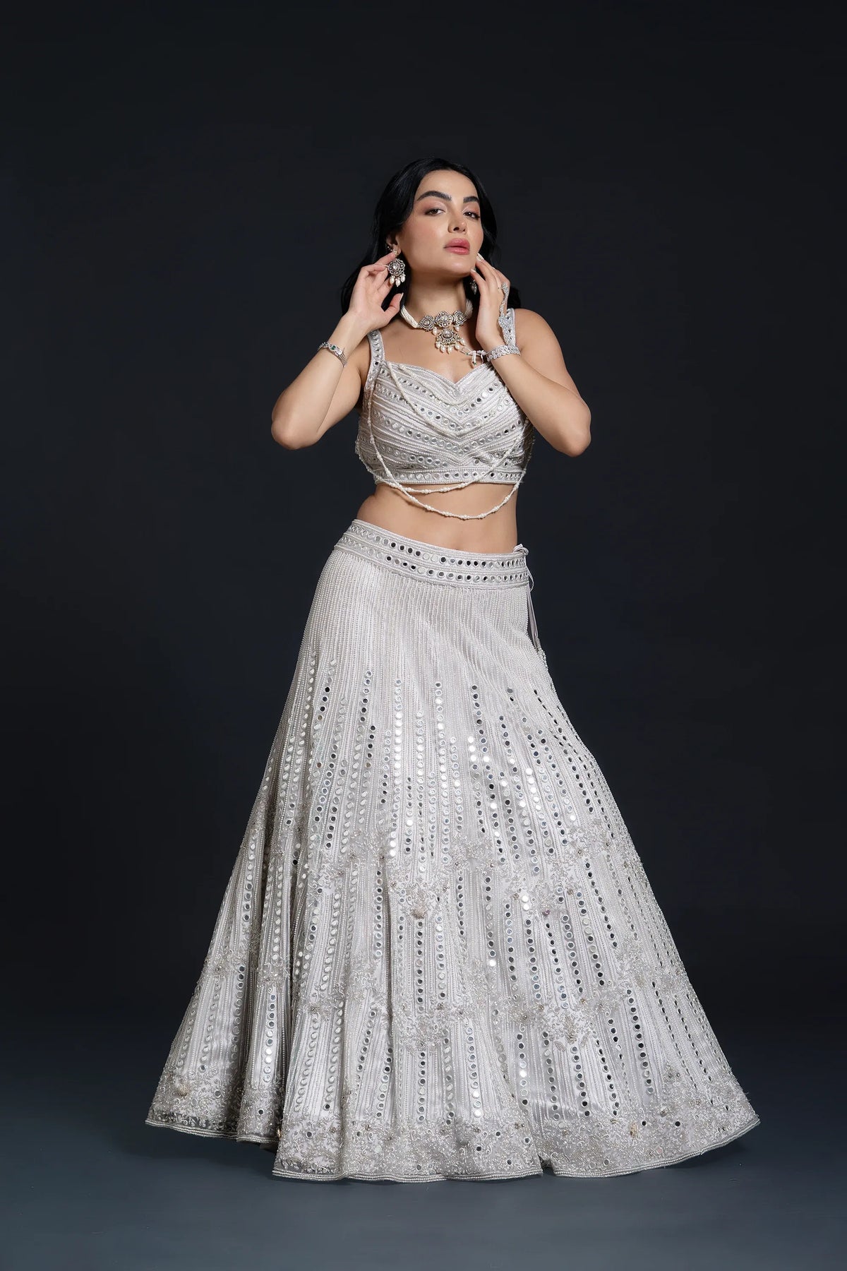 Ivory Bridal Lehenga Set with Mirror Work and Pearl Work Embroidery for Reception Wear by Aahana's by Nidhi Mehra