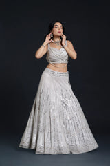 Ivory Bridal Lehenga Set with Mirror Work and Pearl Work Embroidery for Reception Wear by Aahana's by Nidhi Mehra