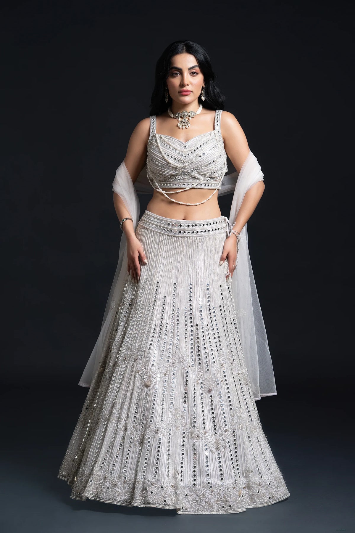 Ivory Bridal Lehenga Set with Mirror Work and Pearl Work Embroidery for Reception Wear by Aahana's by Nidhi Mehra