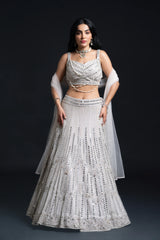 Ivory Bridal Lehenga Set with Mirror Work and Pearl Work Embroidery for Reception Wear by Aahana's by Nidhi Mehra