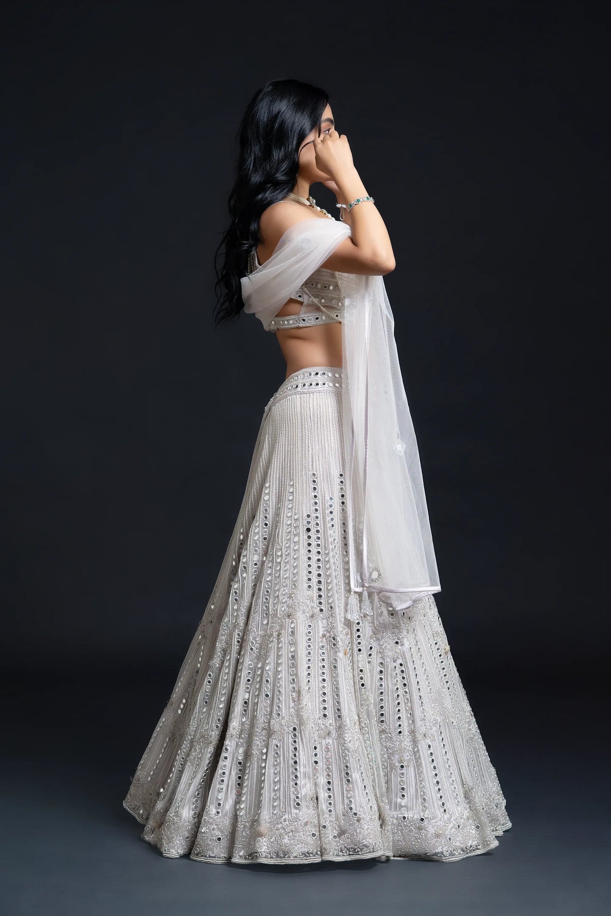 Ivory Bridal Lehenga Set with Mirror Work and Pearl Work Embroidery for Reception Wear by Aahana's by Nidhi Mehra