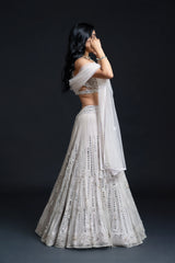 Ivory Bridal Lehenga Set with Mirror Work and Pearl Work Embroidery for Reception Wear by Aahana's by Nidhi Mehra