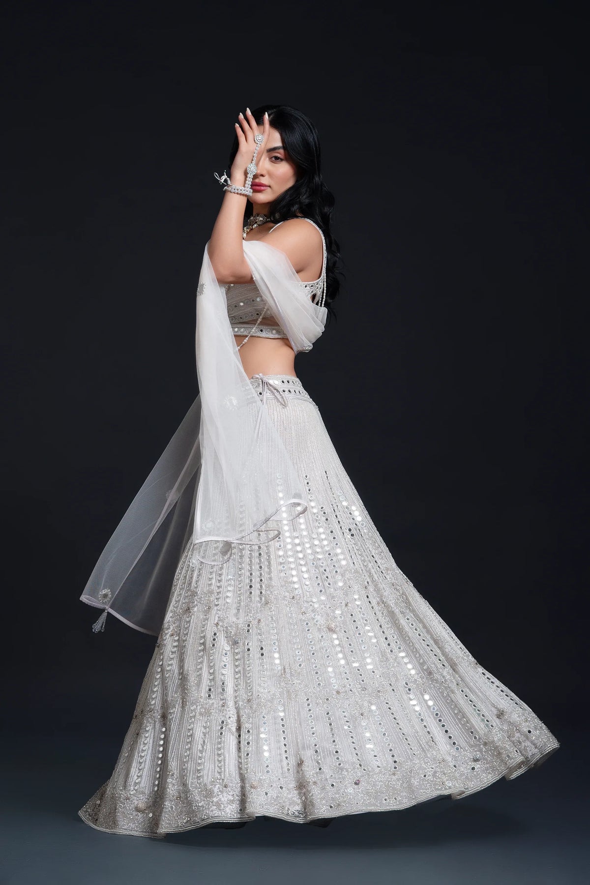 Ivory Bridal Lehenga Set with Mirror Work and Pearl Work Embroidery for Reception Wear by Aahana's by Nidhi Mehra