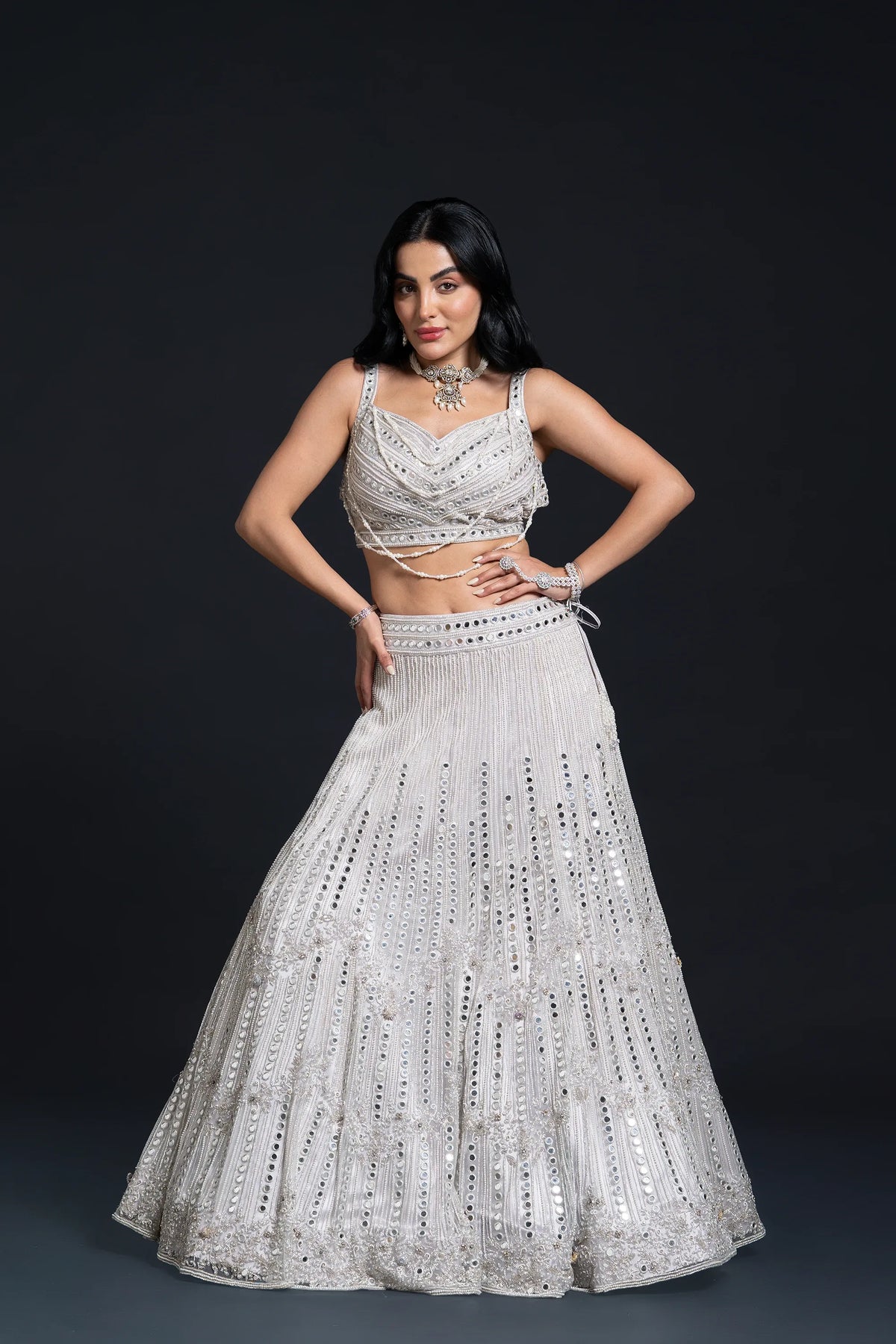 Ivory Bridal Lehenga Set with Mirror Work and Pearl Work Embroidery for Reception Wear by Aahana's by Nidhi Mehra