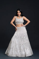 Ivory Bridal Lehenga Set with Mirror Work and Pearl Work Embroidery for Reception Wear by Aahana's by Nidhi Mehra