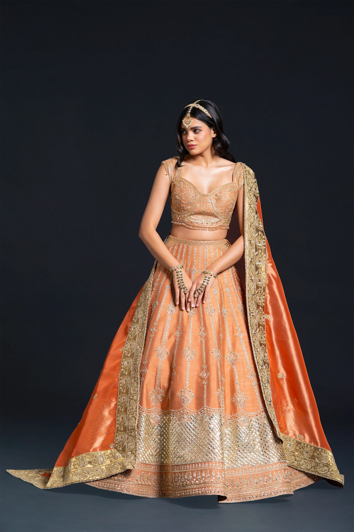 Orange Raw Silk Bridal Lehenga with Dabka and Sequin Embroidery for Reception Wear by Aahana's by Nidhi Mehra