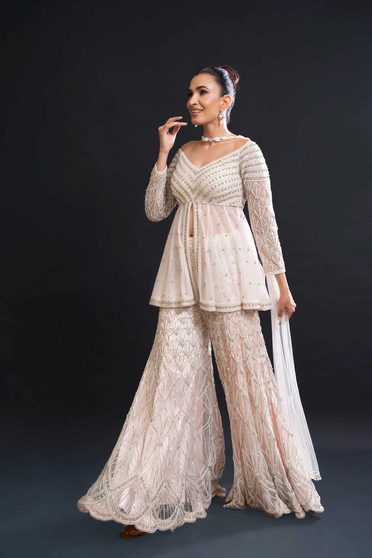 Blush Pink Bridal Sharara Set with Pearl Work and Sequin Embroidery for Sangeet and Reception Wear by Aahana's by Nidhi Mehra