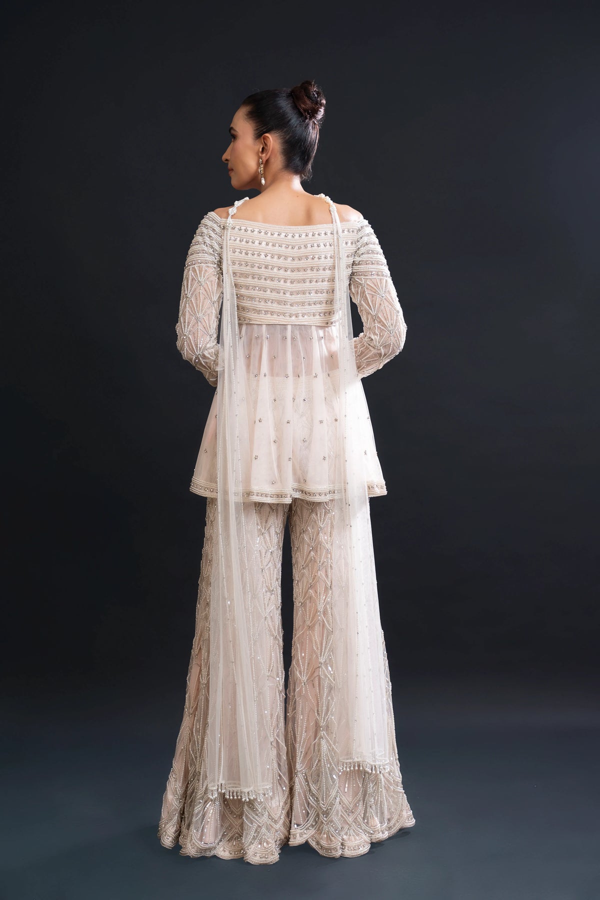 Blush Pink Bridal Sharara Set with Pearl Work and Sequin Embroidery for Sangeet and Reception Wear by Aahana's by Nidhi Mehra