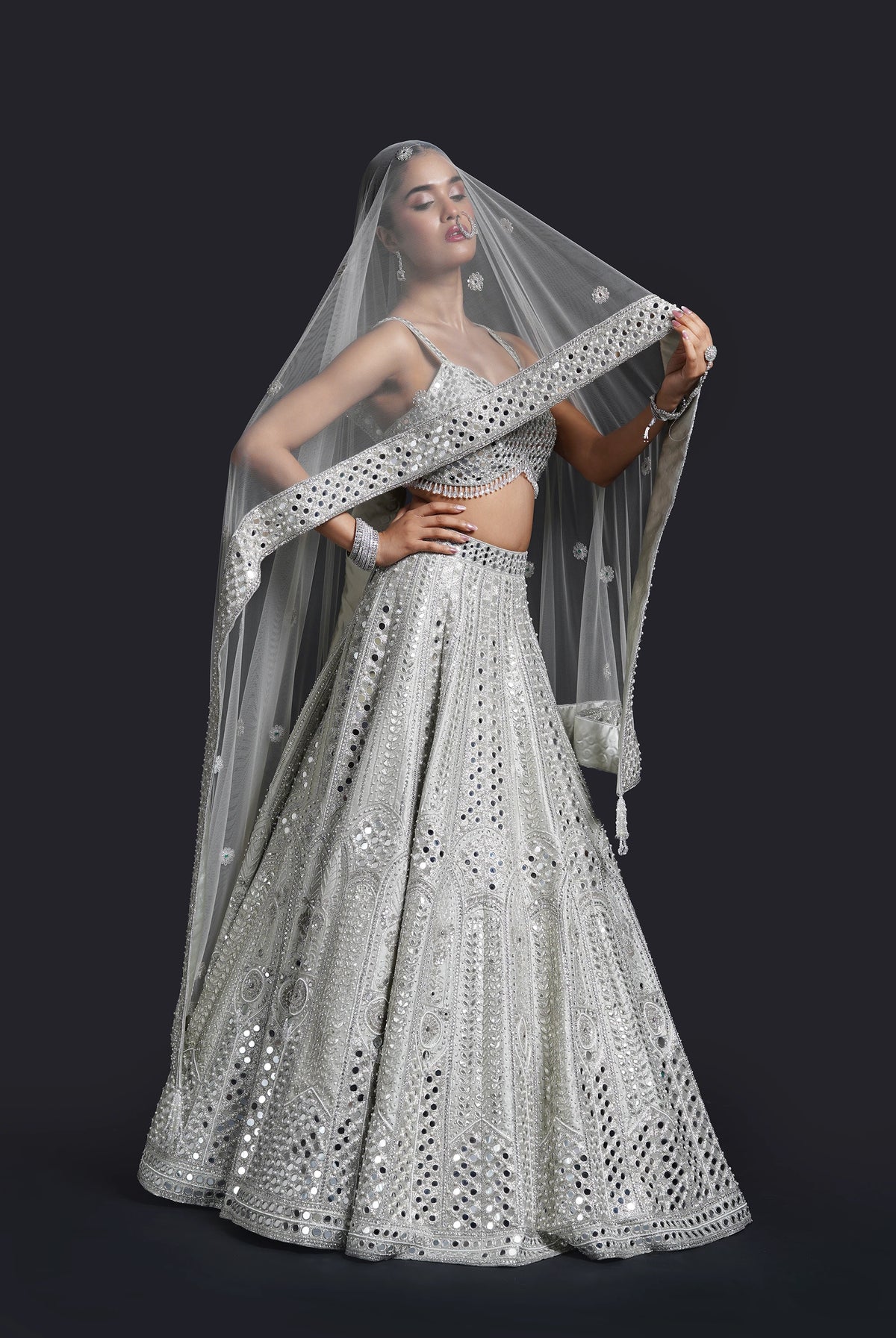 Sage green mirror work lehenga with dabka and gota patti embroidery