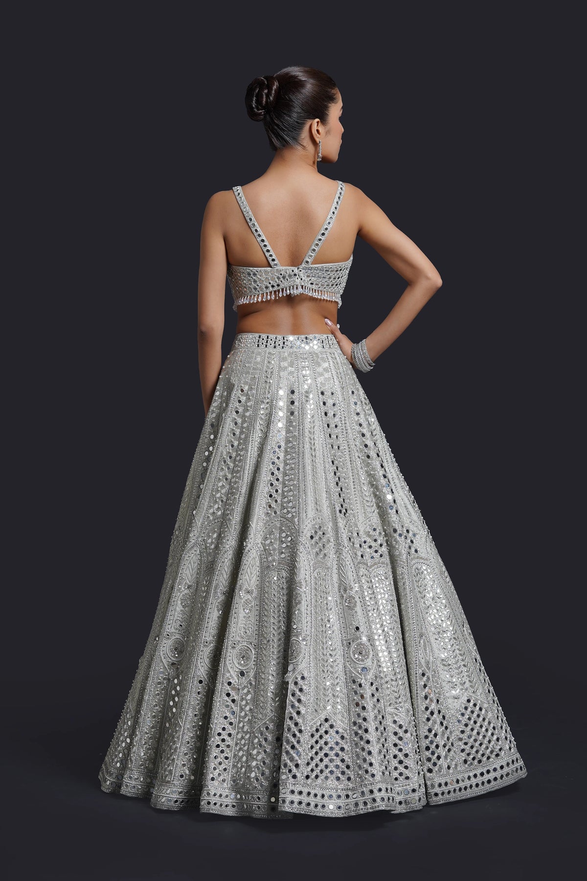 Sage green bridal lehenga blouse with mirror and pearl embroidery